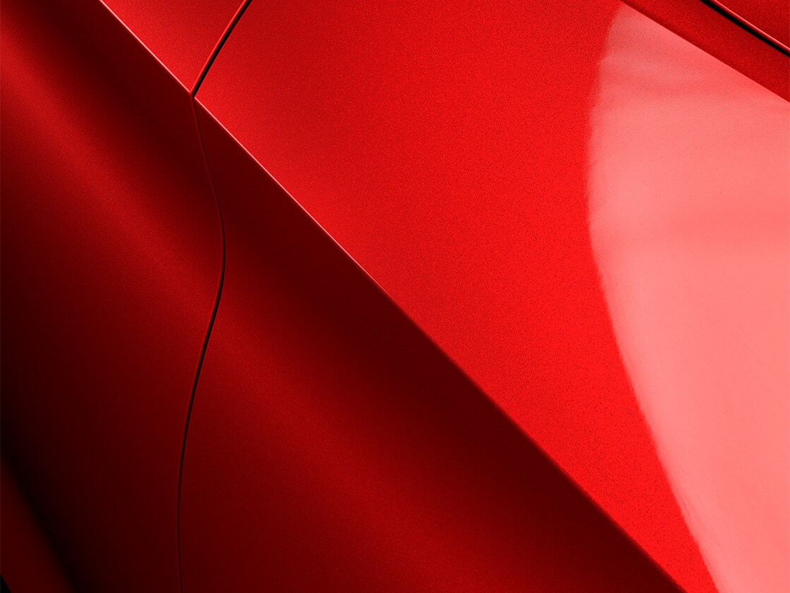 Seat leon en rouge désir avec finition métallisée spéciale, gros plan.